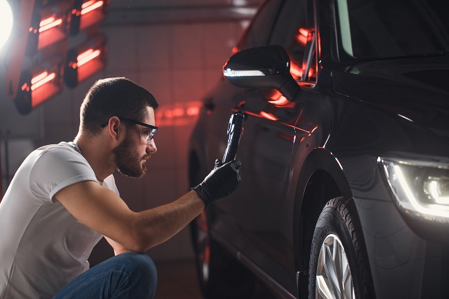 repairing a dent on a car